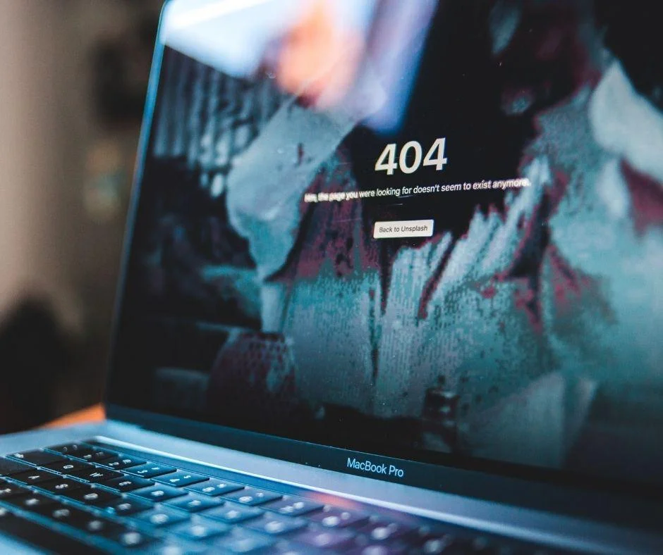 MacBook Pro screen displaying a 404 error page, symbolizing digital marketing performance gaps and broken links.