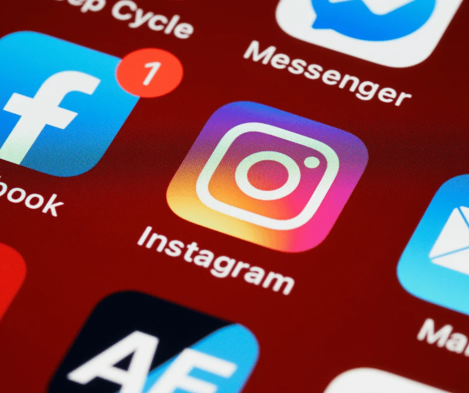 Smartphone screen showing social media app icons, relevant to managing paid social campaigns effectively.