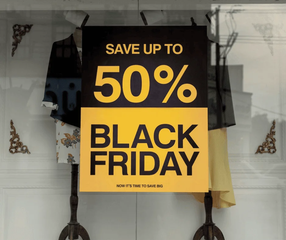 Black Friday sale sign in a store window advertising up to 50% off