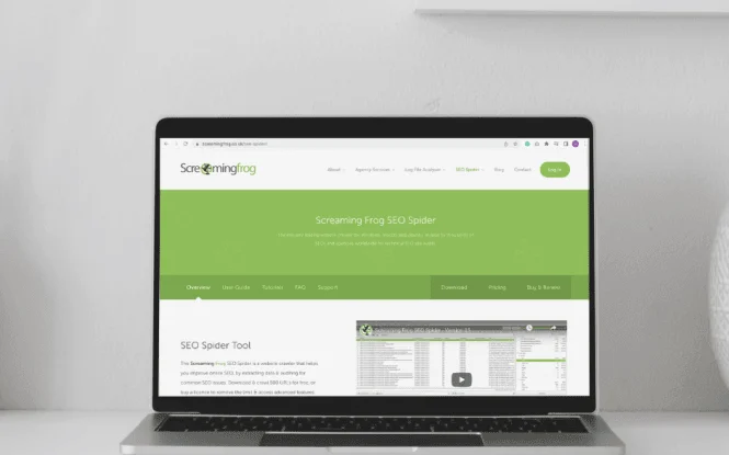 Laptop screen displaying the Screaming Frog SEO Spider website, one of three essential SEO tools for organic search.